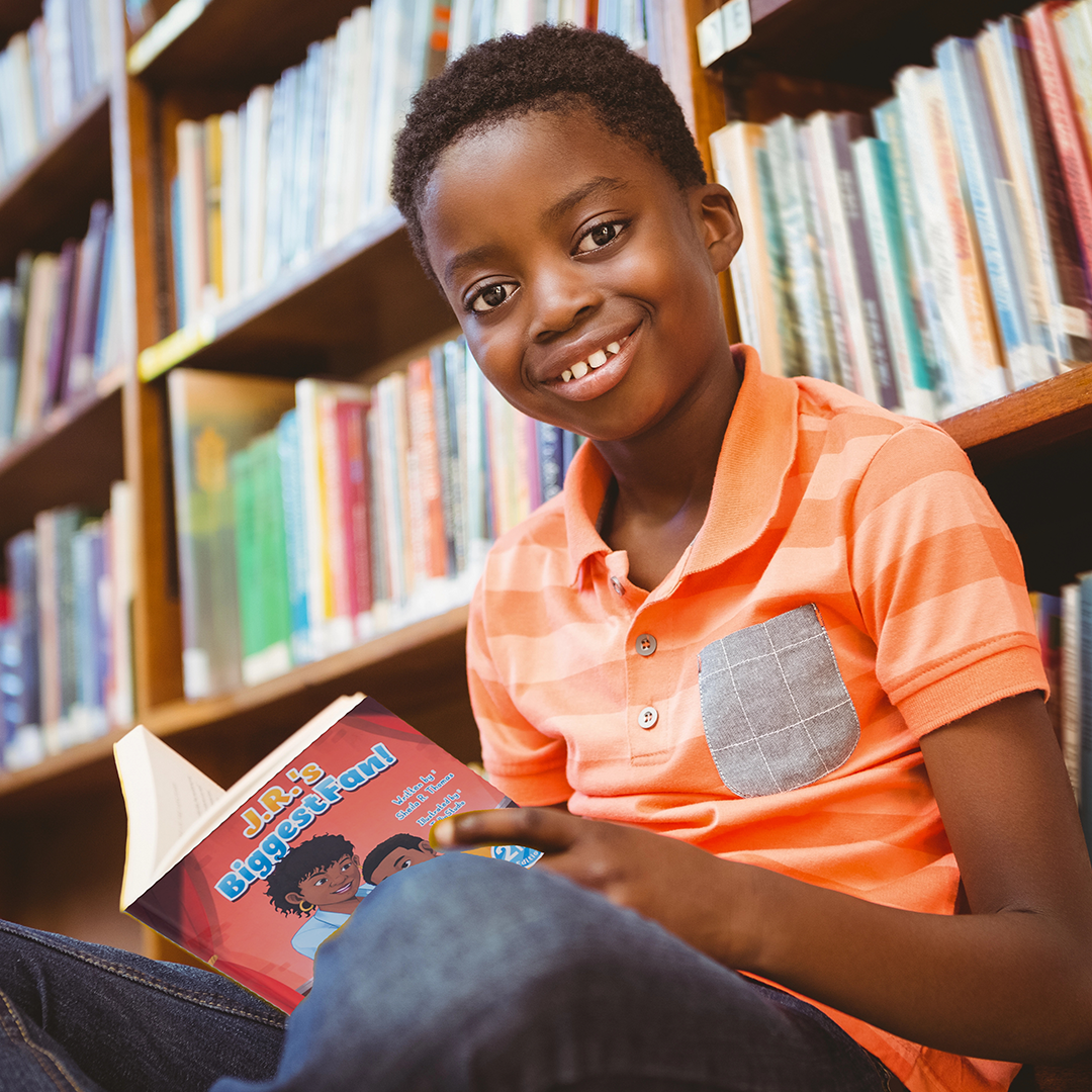 Boy reading J.R.'s Biggest Fan