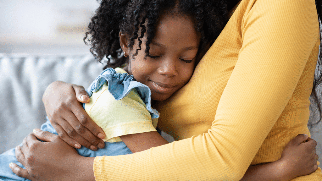 Daughter hugging mother