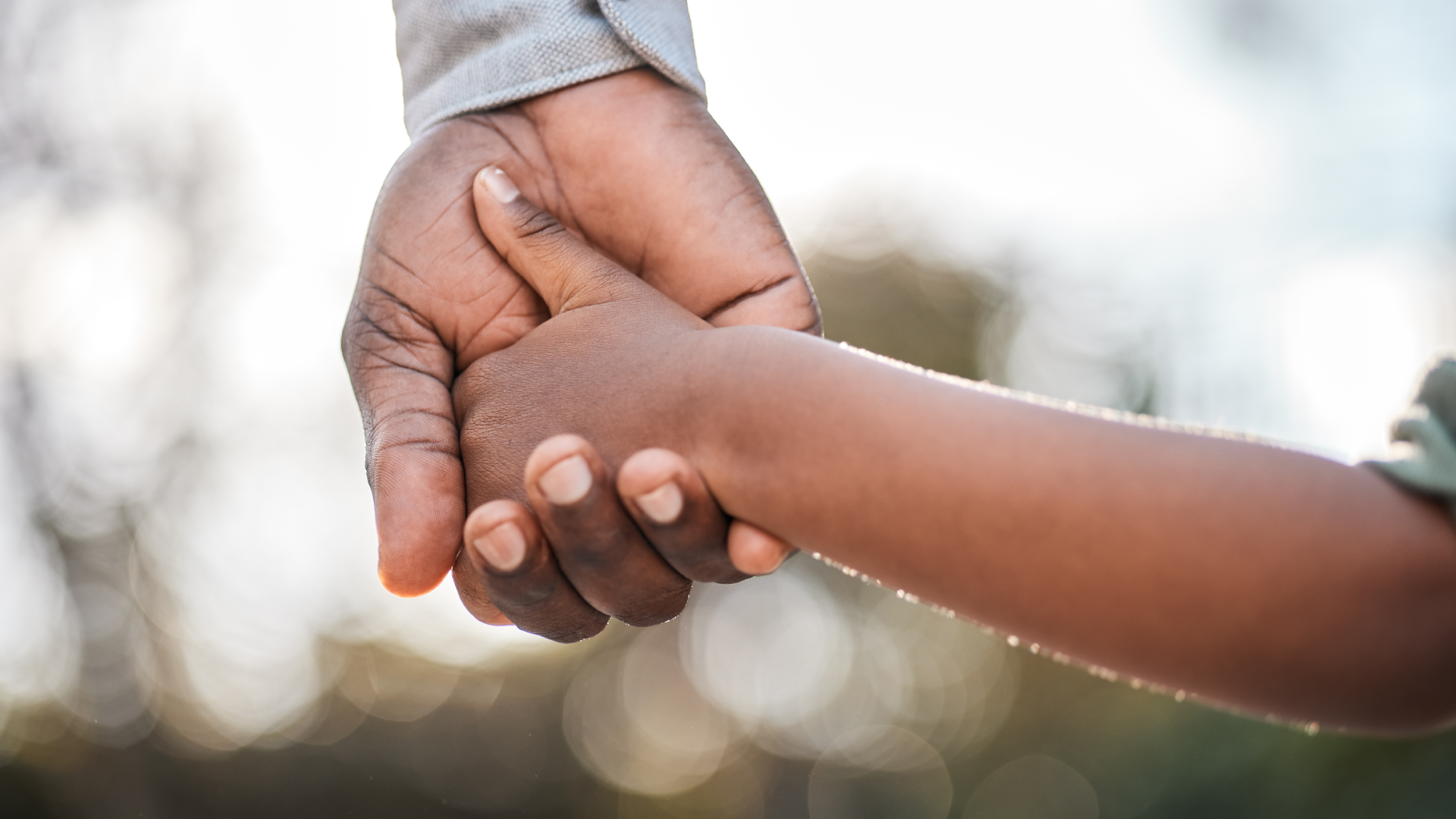 Father and Son hold hands